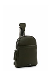 Olive green leather sling bag with a smooth texture, double zip closure, front pocket, and adjustable strap. Silver hardware accents.