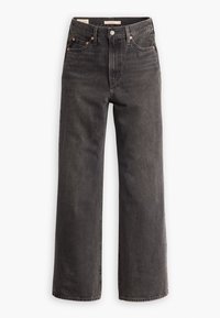 Jean noir taille haute, coupe droite, avec bouton et fermeture éclair à l'avant, design à cinq poches et détails en rivets de cuivre sur fond blanc.