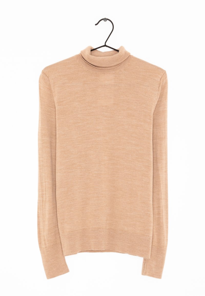 Beige turtleneck sweater made of fine knit fabric, featuring long sleeves, a snug collar, and a straight hem. Hangs on a black metal hook.