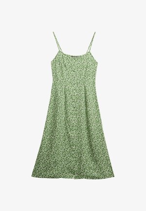 Robe verte avec des bretelles fines, ornée d'un motif floral de marguerites blanches, avec un buste ajusté et une jupe évasée, fabriquée en tissu léger.