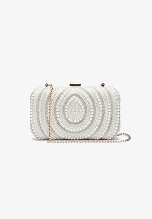 White clutch purse adorned with concentric pearl and bead patterns and a thin gold chain strap on a white background.
