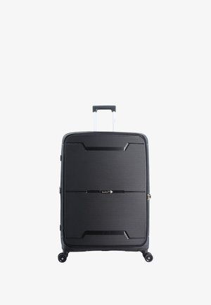 Hard-shell black suitcase with textured surface, featuring a telescopic handle and four wheels for maneuverability. Compact design.