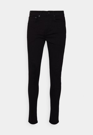 Mustat slim fit -farkut, joissa on nappi- ja vetoketjusuljin, etu- ja takataskut, esillä valkoista taustaa vasten.