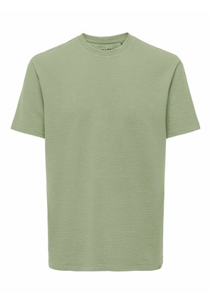 Green short-sleeve T-shirt made of textured fabric, featuring a round neckline and a loose fit. Simple design with no visible patterns or accents.