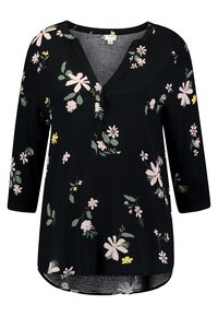 Blouse noire à manches trois-quarts, décolleté en V et imprimé floral en rose, jaune et vert. Tissu doux avec un ourlet arrondi.