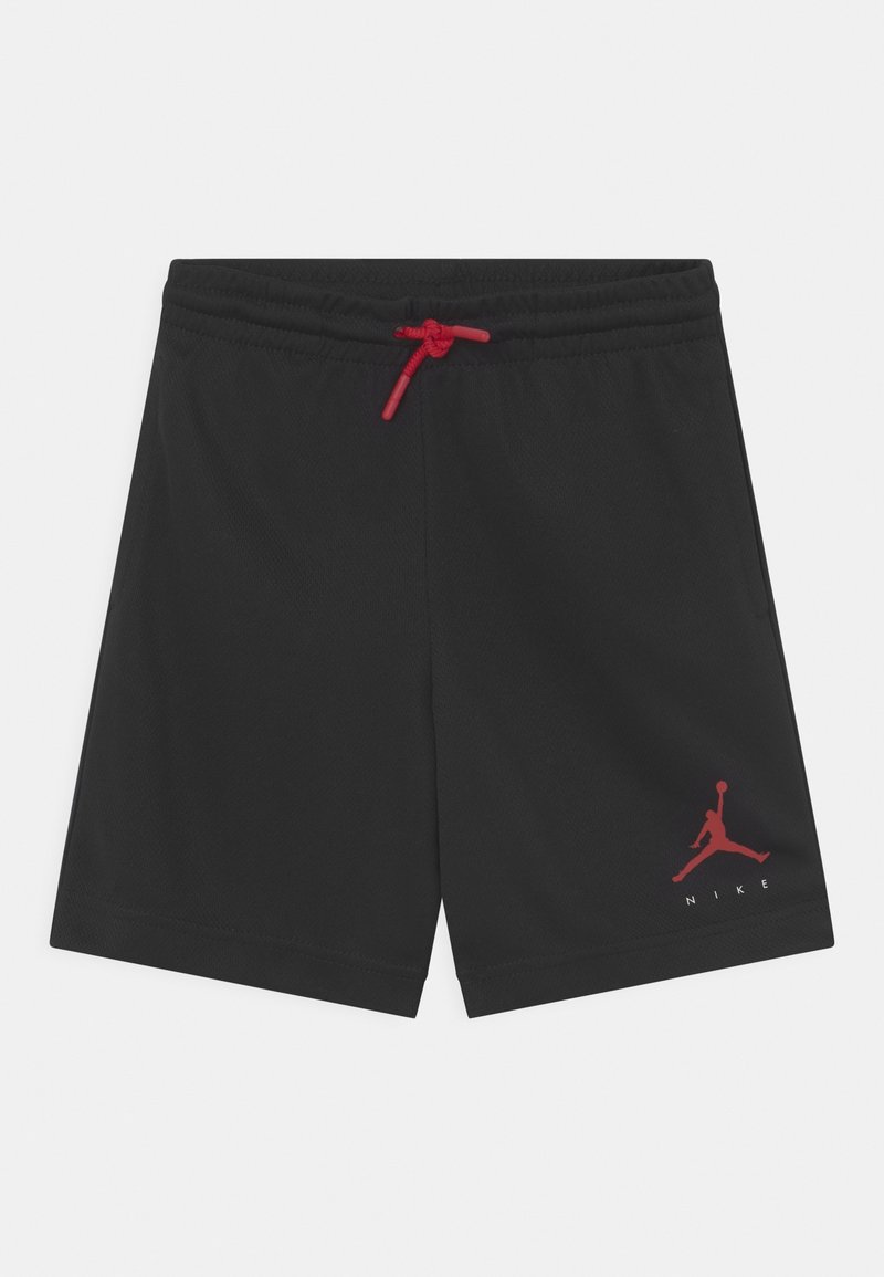 Pantaloni sportivi neri realizzati in tessuto leggero con un cordoncino rosso. Presentano un logo Jordan rosso sulla parte anteriore in basso a sinistra.