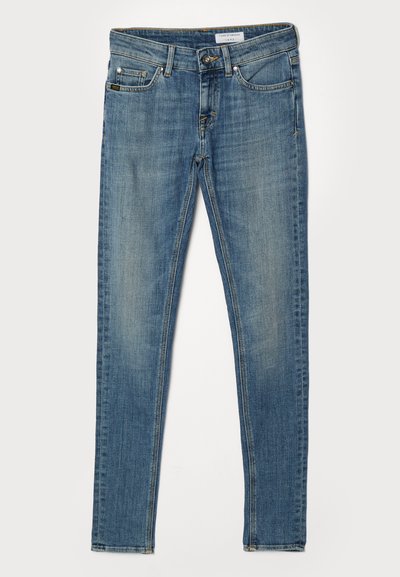 Jeans subțiri din denim de culoare albastră deschisă. Au cinci buzunare, fermoar la fly și cusături galbene contrastante pe cusături și buzunare.
