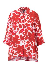 Chemise à boutons rouge et blanche à motifs floraux, à manches courtes, avec une coupe ample, de grands motifs de feuilles et un design de col classique.
