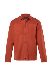 Giacca camicia color ruggine con bottone frontale, due tasche sul petto e maniche lunghe. Realizzata in un tessuto testurizzato con una finitura liscia.