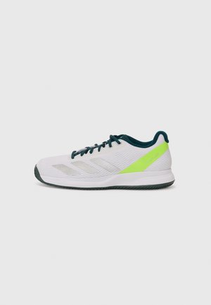 White athletic shoe with a textured mesh upper, green accents on the heel, and three metallic silver stripes on the side. Rubber sole.