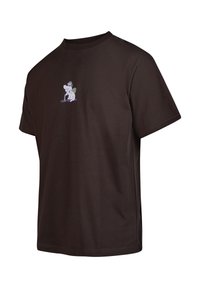 Brown cotton T-shirt featuring a small cartoon design on the chest. Short sleeves, crew neck, and a relaxed fit.