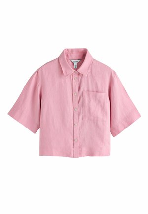 Short-sleeve cropped pink button-up shirt with pointed collar and chest pocket, displayed on white background.