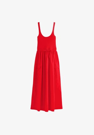 Červené šaty bez rukávů s přiléhavým korzetem, elastickým pasem a dvěma bočními kapsami. Tkanina má hladkou texturu a sahá do poloviny lýtek.
