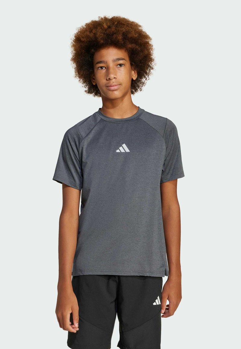 Gray short-sleeve athletic shirt with raglan sleeves, featuring a small white Adidas logo on the chest. The fabric appears smooth and lightweight.