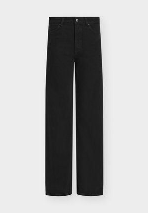 Mustad laia säärega teksad, valmistatud denimist, millel on nööpidega sulgumine ja viis taskut. Sile tekstuur ning puhas, minimalistlik disain.