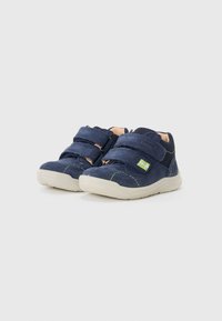Blue suede children's shoes with two adjustable Velcro straps, contrasting lime green stitching, and a white rubber sole.