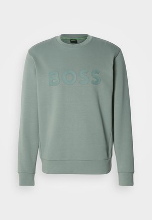 Mėtinės žalios spalvos džemperis su iškilmingu "BOSS" logotipu, apvaliu kaklu, ilgomis rankovėmis, pūstomis rankogaliais ir švelniu audiniu.