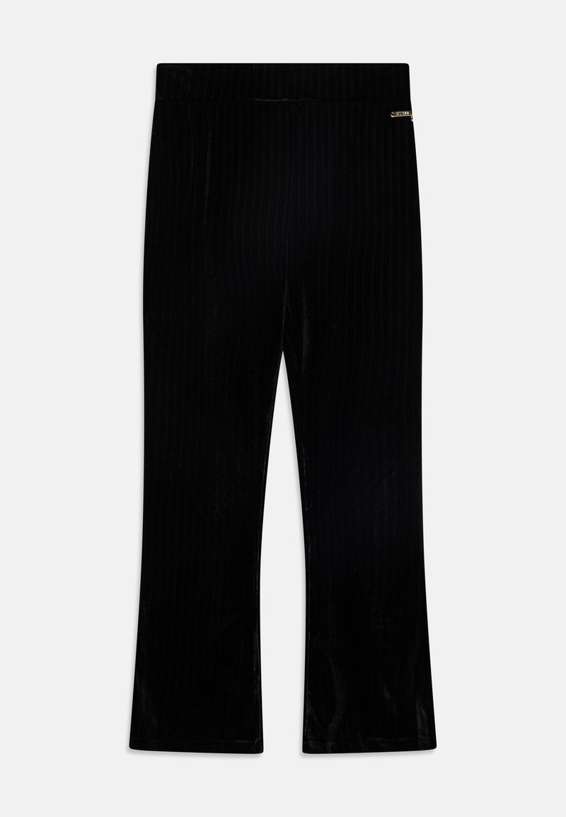 Pantalon évasé en velours côtelé noir avec une taille élastique. Détail d'un petit accent métallique sur le côté. Texture lisse sur toute la surface.