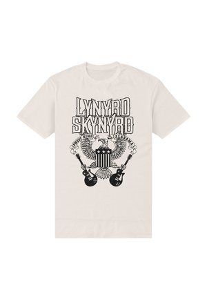 Beżowa koszulka z czarnym nadrukiem orła trzymającego dwie gitary oraz napisem „Lynyrd Skynyrd Sweet Home Alabama” nad i wokół orła.
