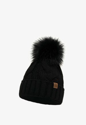 Bonnet en tricot noir avec un bord côtelé épais, doté d'un pompon noir duveteux sur le dessus et d'une petite étiquette en cuir de marque sur le côté.