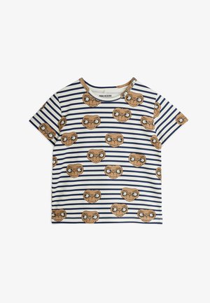 Svītrains īsām piedurknēm krekls baltā un tumši zilā krāsā, ar atkārtotiem karikatūru varoņu sejām brūnā krāsā. Kokvilnas materiāls, apaļa izgriezne.