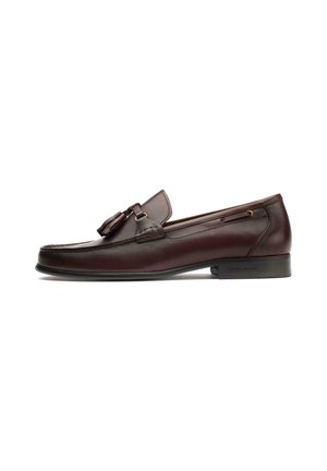 Brown leather loafers featuring a decorative tassel, smooth texture, rounded toe, and subtle stitching, with a low, slightly raised heel.