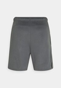 Graue Sportshorts mit einem elastischen Bund, glattem Stoff und seitlichen Taschen. Gerader Schnitt mit minimalistischem Design und ohne sichtbare Muster.