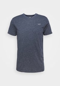 Námořnická modrá polokošile s krátkým rukávem a výstřihem do V, vyrobená z texturované látky, s malým logem na levé části hrudi.