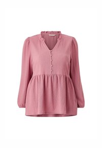 Pink, long-sleeve blouse with a ruffled neckline, button front, and a peplum waist. Features a textured fabric with subtle creasing.