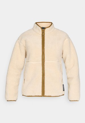 Beige fleece jack met hoge kraag, ritssluiting aan de voorkant, lange mouwen en contrasterende bruine afwerking. Beschikt over twee zijzakken en een zachte textuur.