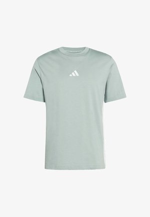 Heled hallikas lühikeste varrukatega T-särk, ümberkaudse kaelusega, millel on rindkeres väike valge Adidas logo ja valged külgmised triibud. Puuvillane materjal.