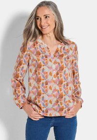 Langärmlige Bluse aus leichtem Stoff mit floralem Muster in Rosa-, Orange- und Brauntönen; V-Ausschnitt mit Knopfdetails an der Vorderseite.