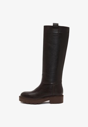 Brown leather knee-high boot with a textured finish, round toe, and chunky rubber sole, featuring a pull tab at the back for easy wear.