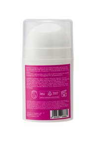 Bottiglia cosmetica cilindrica rosa e bianca con tappo a pompa. L'etichetta sul retro mostra l'elenco degli ingredienti e le istruzioni per l'uso in italiano.