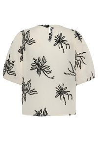 Blouse crème à manches courtes bouffantes, ornée de motifs floraux abstraits noirs en perles et d'une petite fermeture à bouton dans le dos.