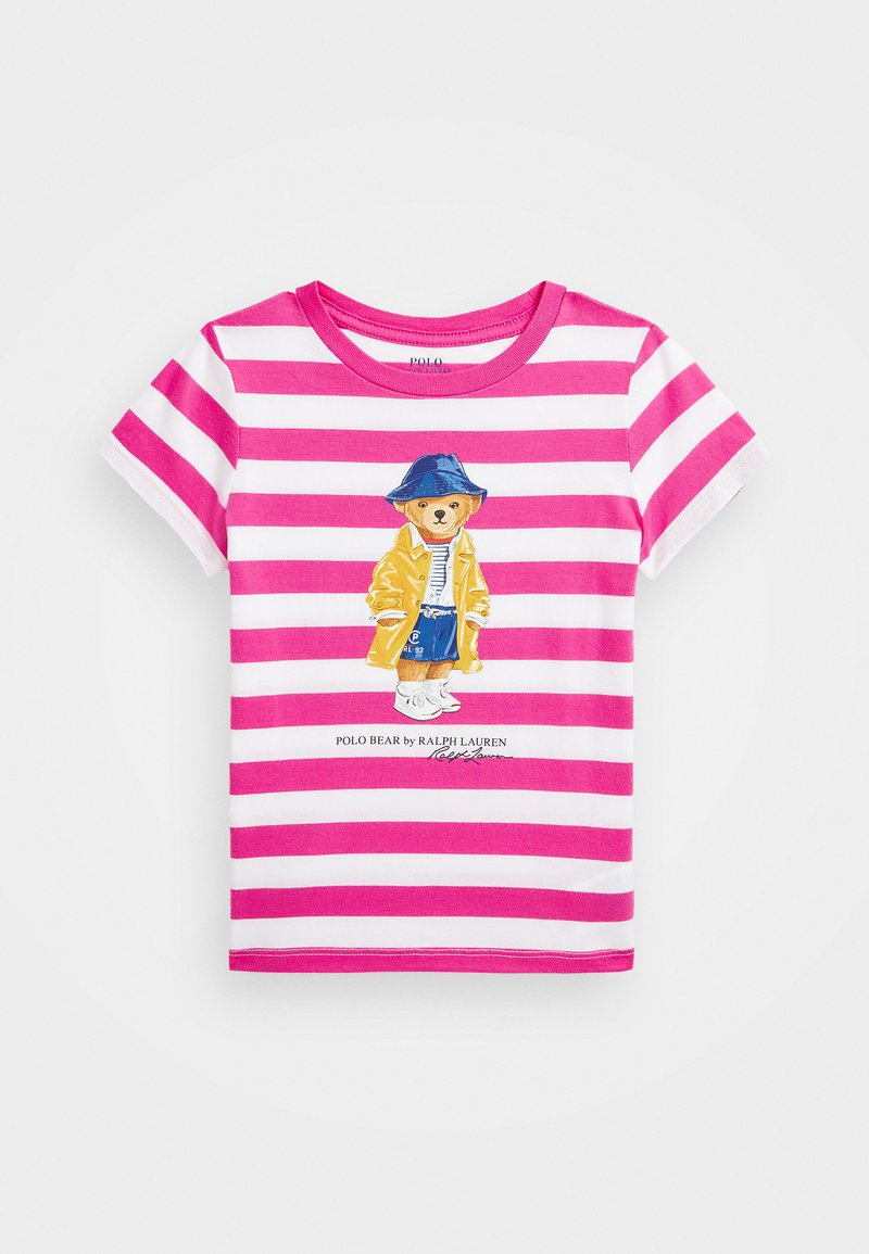 Kortärmad t-shirt med rosa och vita ränder. Har en grafik av en björn i ett gult plagg och blå hatt, med texten "Polo Bear by Ralph Lauren".