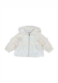 Veste coupe-vent crème clair avec capuche, détails plissés aux épaules, fermeture éclair frontale et poignets élastiques. Confectionnée en tissu lisse et léger.