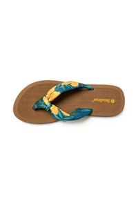 Chancla con suela texturizada marrón y una tira de tela floral en azul verdoso con flores amarillas, que presenta un diseño de nudo en el centro.