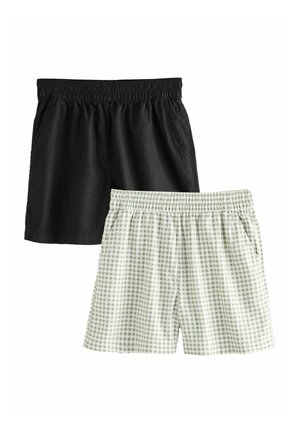 Zwei Paar Shorts mit elastischem Bund, eines einfarbig schwarz und eines hellgrün weiß kariert, flach auf weißem Hintergrund präsentiert.