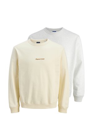 Två crewneck-sweatshirts: en i krämfärg med broderad text, den andra i ljusgrått. Båda har ribbade cuffar och krage.