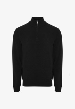 Sort striktrøje med høj krave og halvlang lynlås foran. Har lange ærmer og ribbet tekstur ved manchetter og kant.