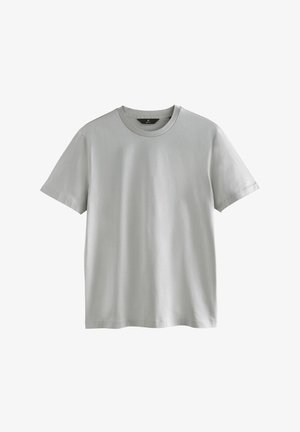 Jasnoszara koszulka z gładkiej bawełny, z klasycznym okrągłym dekoltem, krótkimi rękawami oraz luźnym krojem i minimalnymi detalami w szwie.