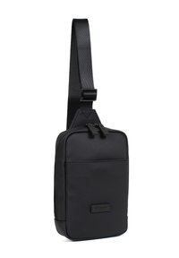 Borsa a tracolla nera realizzata in tessuto texture con una singola tracolla regolabile, due scomparti con zip e una patch logo sul davanti.