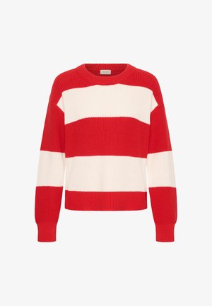 Pull en tricot rayé rouge et blanc avec manches longues et encolure ronde, présentant de larges blocs de couleur horizontaux.
