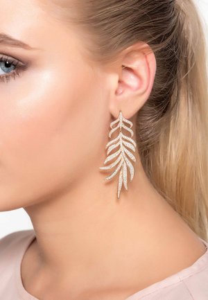 Gold-tone earrings shaped like leaves, featuring a layered design with rhinestone accents, suspended from a stud fastening.