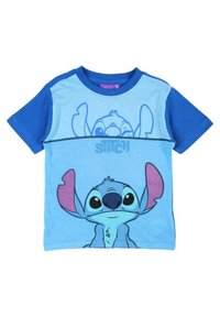 T-shirt en coton bleu affichant un imprimé graphique d'un personnage de dessin animé avec de grandes oreilles et des yeux expressifs. Manches courtes, col rond.