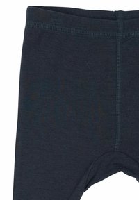 Temno modre legice iz mehke, elastične tkanine z gladko teksturo. Imajo širok pas in ravne šive za udobje.