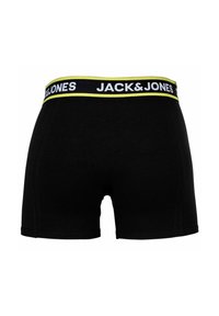 Boxer shorts noirs avec une ceinture élastique de marque, arborant un logo blanc et un accent jaune. Tissu lisse avec une coupe ajustée.