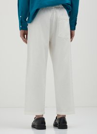 Calliope CORTI WIDE  - Jogginghose - bianco