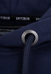 Navy blue hoodie fabric with a round silver eyelet and braided drawstring. Label features black and white text: "SPITZBUB." Smooth texture.